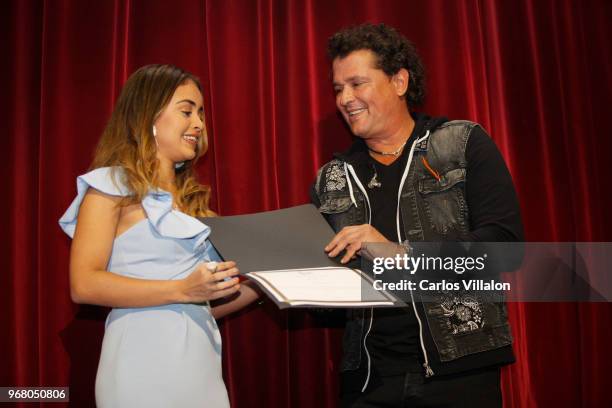 Carlos Vives presents Nicolle Horbath with a scholarship during the Latin GRAMMY Cultural Foundation's Scholarship Presentation on June 5, 2018 in...