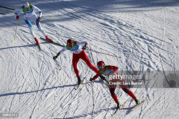 Marit Bjoergen of Norway gold leads Justyna Kowalczyk of Poland and Petra Majdic of Slovenia during the Women's Individual Sprint C Final on day 6 of...
