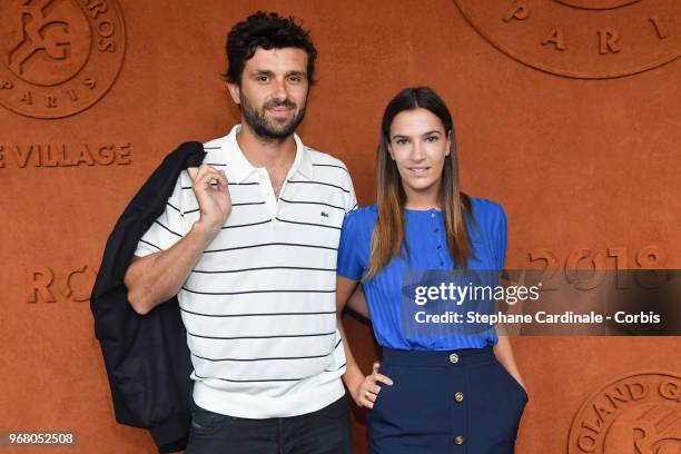 Journalist Antoine Benneteau and actress Charlotte Gabris attend the 2018 French Open - Day Ten at Roland Garros on June 5, 2018 in Paris, France.