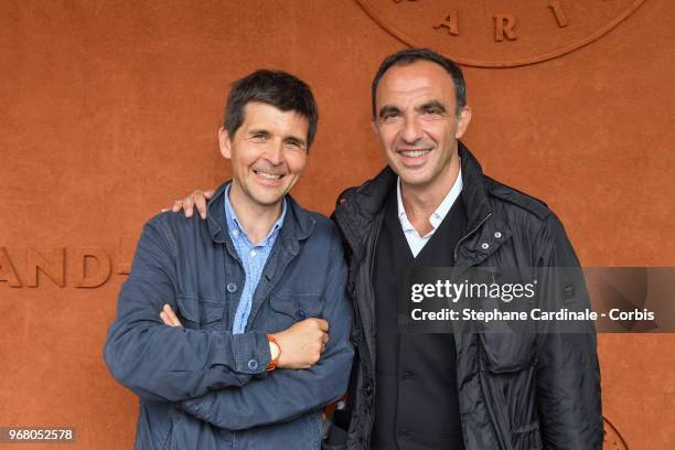 Thomas Sotto and Nikos Aliagas attend the 2018 French Open - Day Ten at Roland Garros on June 5, 2018 in Paris, France.