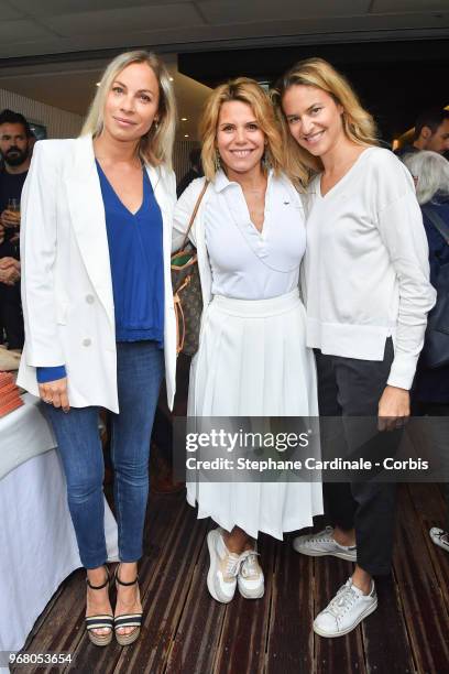 Hosts Charlotte Bouteloup, Laura Tenoudji and Olivia De Buhren attend the 2018 French Open - Day Ten at Roland Garros on June 5, 2018 in Paris,...