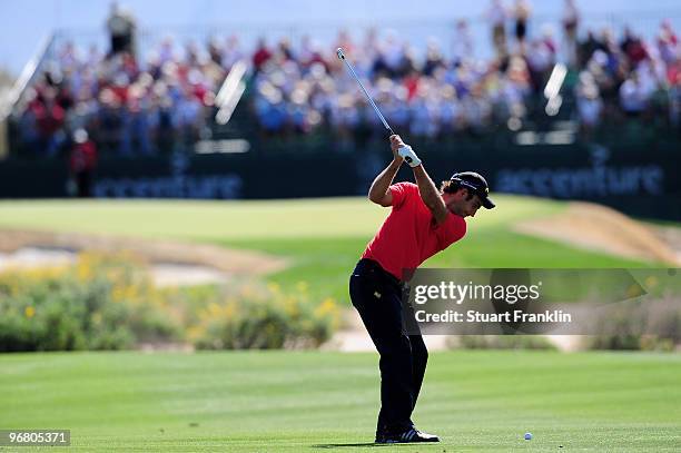 Edoardo Molinari of Italy plays his approach shot on the 17th hole during round one of the Accenture Match Play Championship at the Ritz-Carlton Golf...