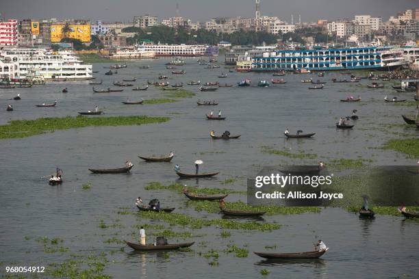 Boats are seen on the Buriganga river on June 5, 2018 in Dhaka, Bangladesh. Bangladesh has been reportedly ranked 10th out of the top 20 plastic...