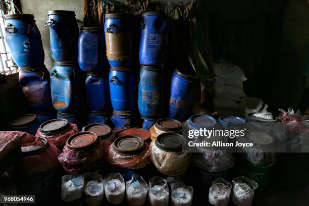 Paint and other chemicals are seen in a dying factory in Shyampur, whose waste is dumped into the Buriganga river, on June 4, 2018 in Dhaka,...