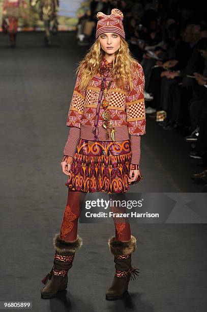 Model walks the runway at the Anna Sui Fall 2010 Fashion Show during Mercedes-Benz Fashion Week at The Tent at Bryant Park on February 17, 2010 in...