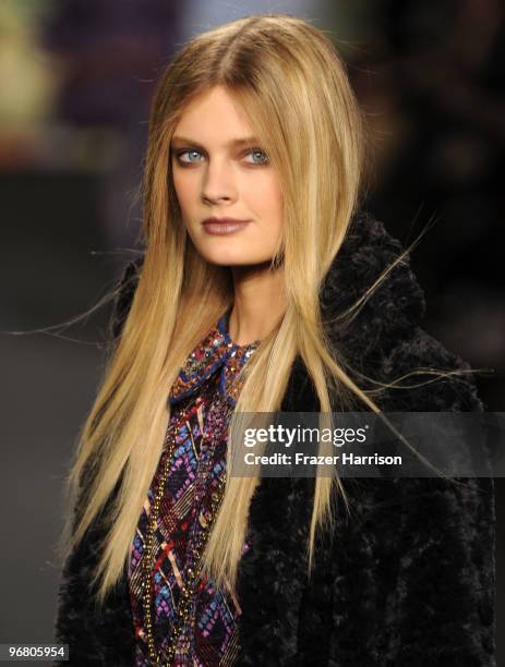 Model walks the runway at the Anna Sui Fall 2010 Fashion Show during Mercedes-Benz Fashion Week at The Tent at Bryant Park on February 17, 2010 in...