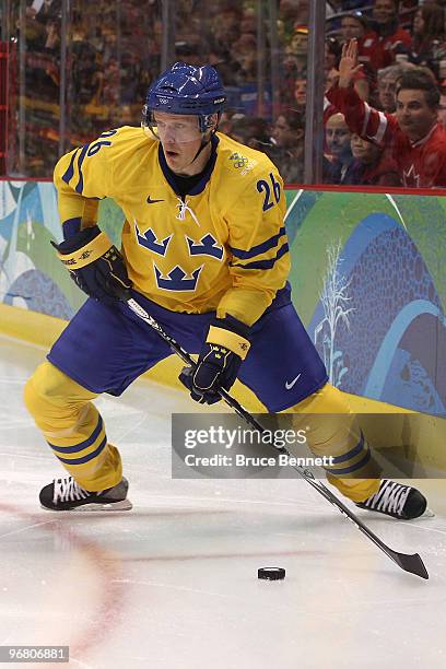 Samuel Pahlsson of Sweden moves the puck against Germany during the ice hockey men's preliminary game on day 6 of the Vancouver 2010 Winter Olympics...