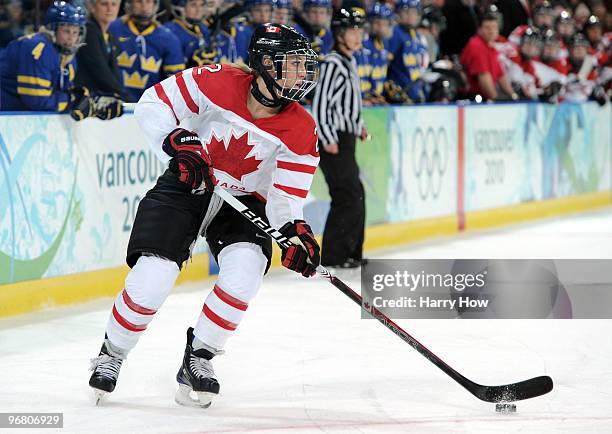 Meghan Agosta of Canada controls the puck during the ice hockey women's preliminary game between Canada and Sweden on day 6 of the 2010 Winter...