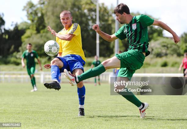 June 02: Alex Svedjuk of Karpatalya and Anri Khagba of Abkhazia during the CONIFA World Football Cup 2018 match between Abkhazia and Karpatalya at...
