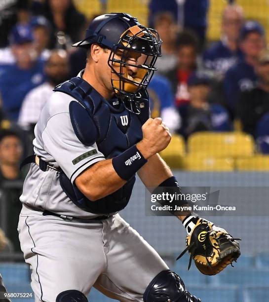 Ellis of the San Diego Padres pumps his fist after the final out of the game against the Los Angeles Dodgers at Dodger Stadium on May 26, 2018 in Los...