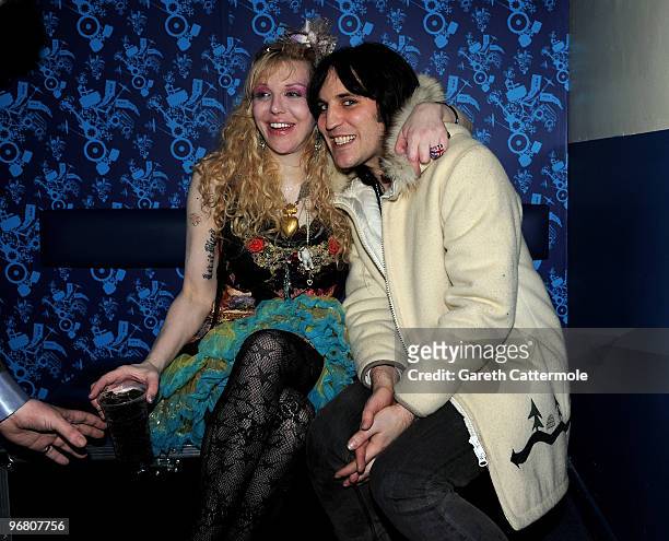 Courtney Love poses with Noel Fielding after her gig with Hole at the NME Shockwaves awards Show at Shepherd's Bush Empire on February 17, 2010 in...