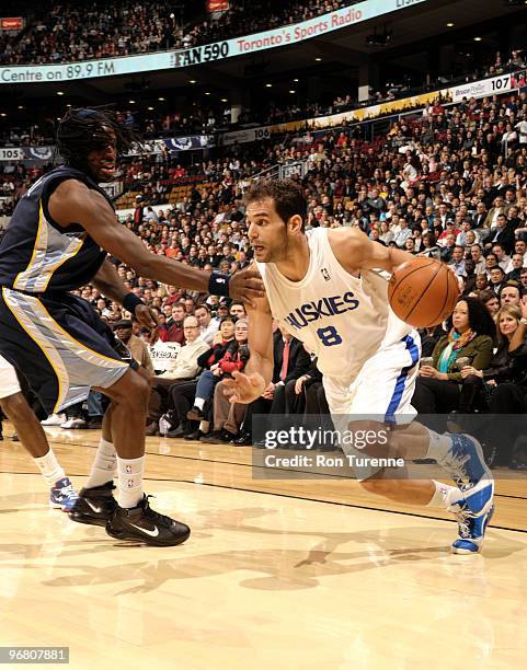 Jose Calderon of the Toronto Raptors drives baseline and gets past DeMarre Carroll of the Memphis Grizzlies during a game on February 17, 2010 at the...