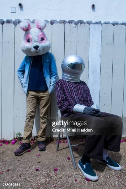 boys in backyard wearing space helmut and bunny mask - rabbit mask fotografías e imágenes de stock