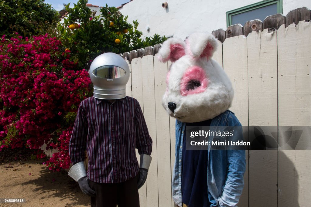 Boys in Backyard Wearing Space Helmut and Bunny Mask