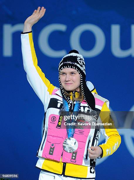 Jenny Wolf of Germany celebrates winning the silver medal during the medal ceremony for the Ladies' 500m Speed Skating on day 6 of the Vancouver 2010...