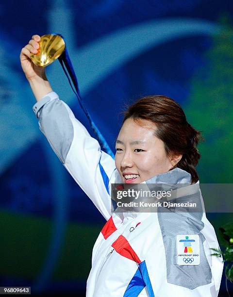 Sang-Hwa Lee of South Korea celebrates with her gold medal during the medal ceremony for the Ladies' 500m Speed Skating on day 6 of the Vancouver...
