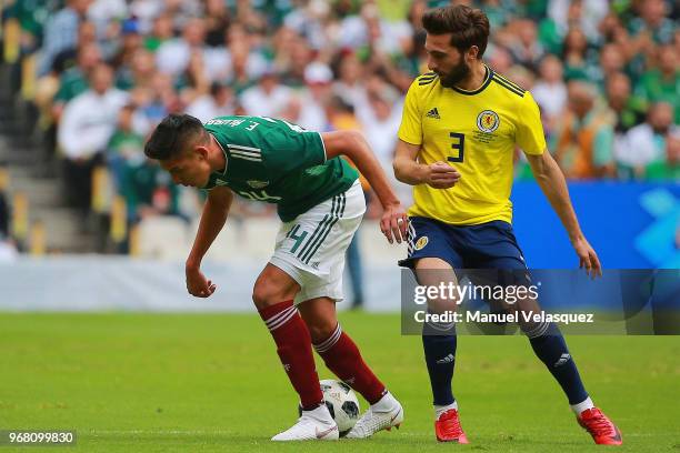 Edson Alvarez of Mexico struggles for the ball against Graeme Shinnie of Scotland during the international friendly match between Mexico and Scotland...