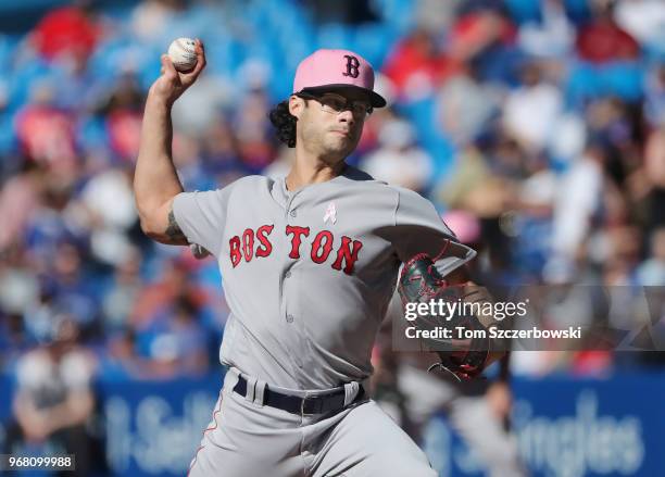 Joe Kelly of the Boston Red Sox delivers a pitch in the ninth inning during MLB game action against the Toronto Blue Jays at Rogers Centre on May 13,...