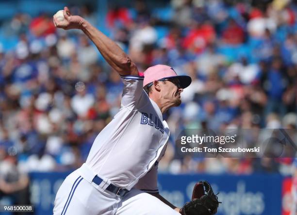 Tyler Clippard of the Toronto Blue Jays delivers a pitch in the ninth inning during MLB game action against the Boston Red Sox at Rogers Centre on...