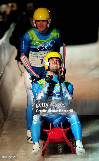 Andreas Linger and Wolfgang Linger of Austria react after their 2nd run in the Luge Doubles final on day 6 of the Vancouver 2010 Winter Olympics at...