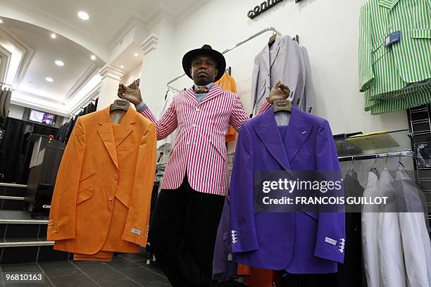 Lifestyle-fashion-Africa-France,FEATURE, by Yomi Abiola Jocelyn Armel poses at his men's clothing boutique on February 10, 2010 in Paris. Armel, the...