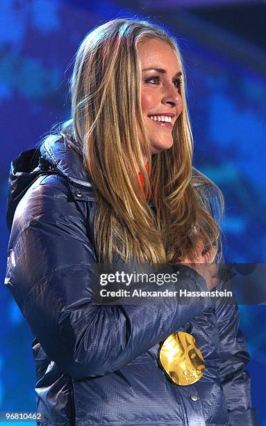 Lindsey Vonn of the United States celebrates with her gold medal during the medal ceremony for the Alpine Skiing Ladies Downhill on day 6 of the...