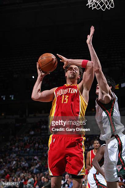 David Andersen of the Houston Rockets is fouled by Ersan Ilyasova of the Milwaukee Bucks on February 17, 2010 at the Bradley Center in Milwaukee,...