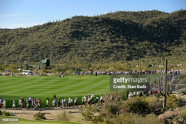 Fans head to the 18th green during the first round of the World Golf Championships-Accenture Match Play Championship at The Ritz-Carlton Golf Club at...