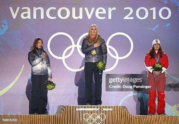 Julia Mancuso of the United States celebrates winning silver, Lindsey Vonn of the United States gold and Elisabeth Goergl of Austria bronze during...