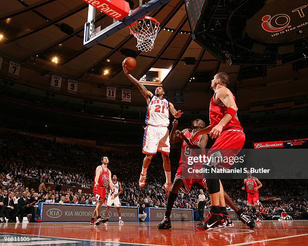 Wilson Chandler of the New York Knicks shoots against Luo Deng of the Chicago Bulls on February 17, 2010 at Madison Square Garden in New York City....