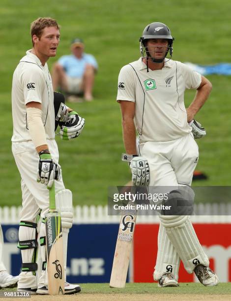 Tim McIntosh and Martin Guptill of New Zealand await the 3rd umpires decision on the runout of Tim McIntosh by Rubel Hossain of Bangladesh during day...
