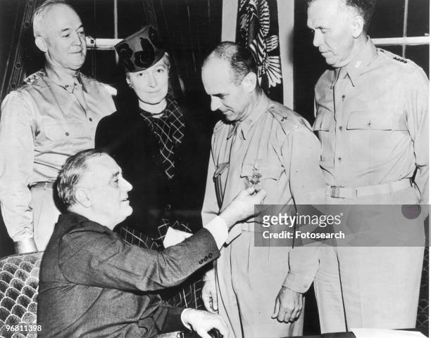 President Franklin D. Roosevelt awards the Congressional Medal of Honor to Brigadier General James Doolittle, may 19, 1942. Attending the ceremony...