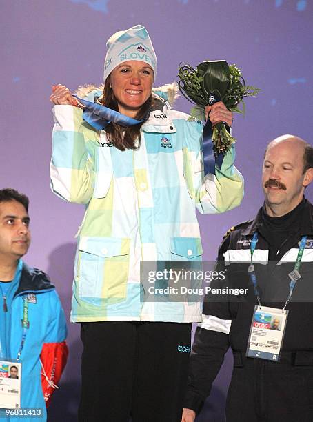 Petra Majdic of Slovenia celebrates with her bronze medal during the medal ceremony for the Ladies' Individual Sprint Cross-Country on day 6 of the...