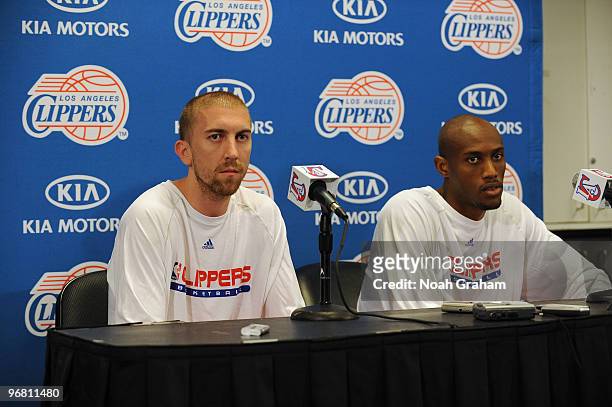 Steve Blake and Travis Outlaw of the Los Angeles Clippers sit during a press conference before a game against the Atlanta Hawks at Staples Center on...