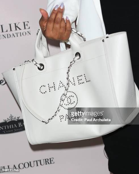 Actress Lela Rochon , handbag detail, attends the Ladylike Foundation's 2018 Annual Women Of Excellence Scholarship Luncheon at The Beverly Hilton...