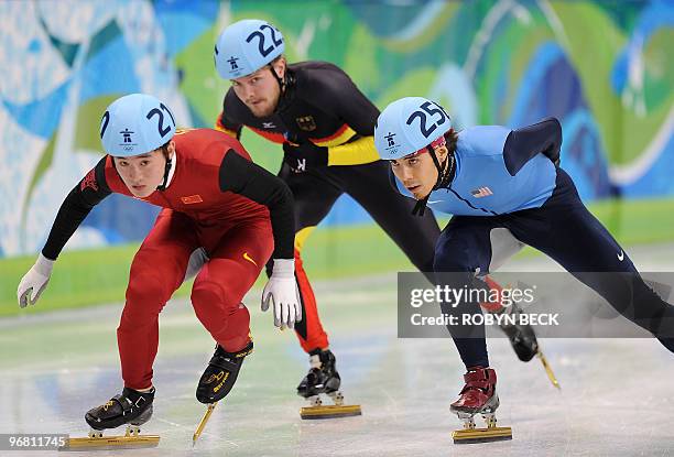 Apolo Anton Ohno of the US, Germany's Paul Herrmann and Wenhao Liang of China compete in the men's 1,000m short-track heats at the Pacific Coliseum...