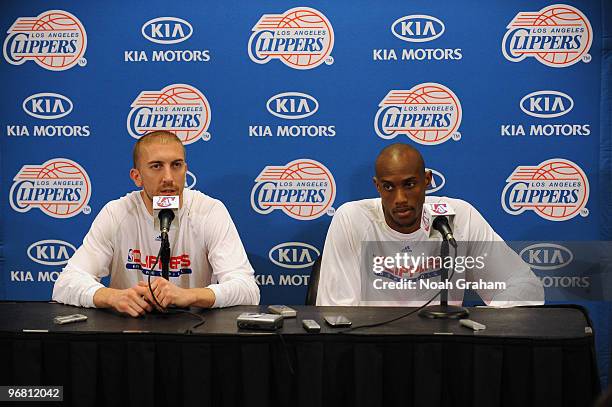 Steve Blake and Travis Outlaw of the Los Angeles Clippers sit during a press conference before a game against the Atlanta Hawks at Staples Center on...