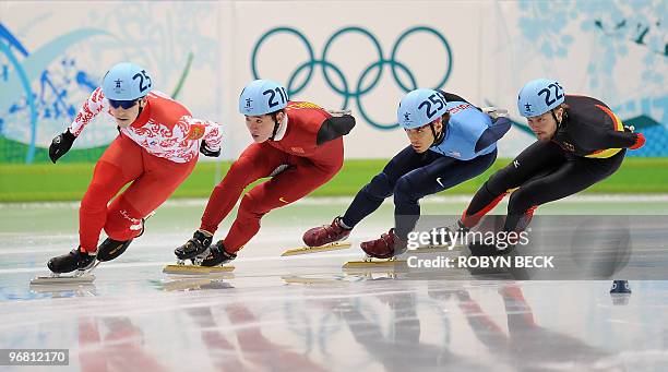 Ruslan Zakharov of Russia, Wenhao Liang of China, Apolo Anton Ohno of the US and Germany's Paul Herrmann compete in the men's 1,000m short-track...