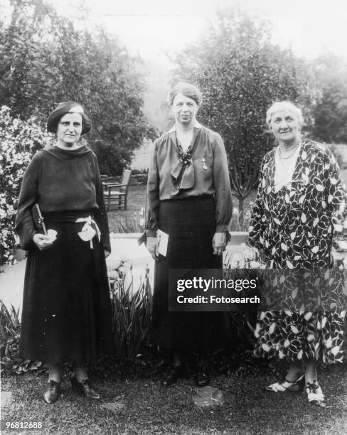 Eleanor Roosevelt, Henry Morgenthau Jr., and Jane Addams stand in garden, circa 1929. .