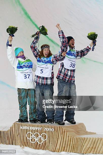 Peetu Piiroinen of Finland poses after winning the silver, Shaun White of the United States poses after winning the gold and Scott Lago after winning...