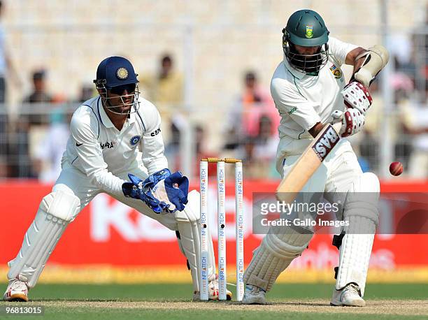 Hashim Amla of South Africa plays a shot to the onside during day five of the Second Test match between India and South Africa at Eden Gardens on...