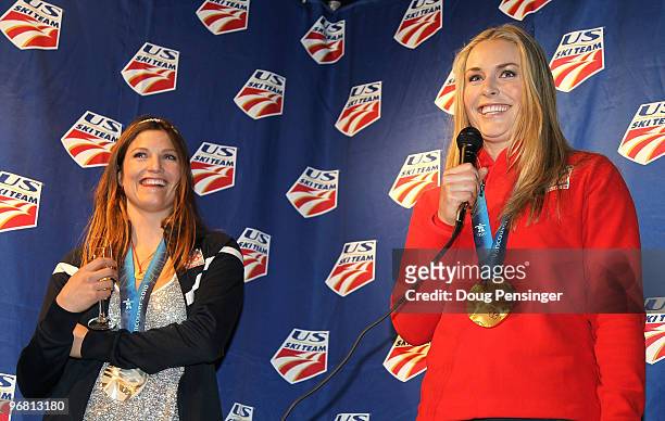 Lindsey Vonn and Julia Mancuso of the United States greet the crowd after receiving the gold and silver medals in the Alpine Skiing Ladies Downhill...
