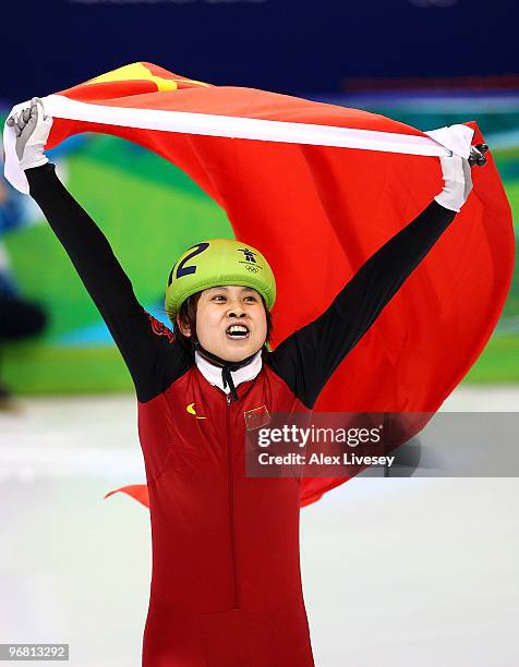 Wang Meng of China celebrates winning the gold medal in the Short Track Speed Skating Ladies' 500 m finals on day 6 of the Vancouver 2010 Winter...
