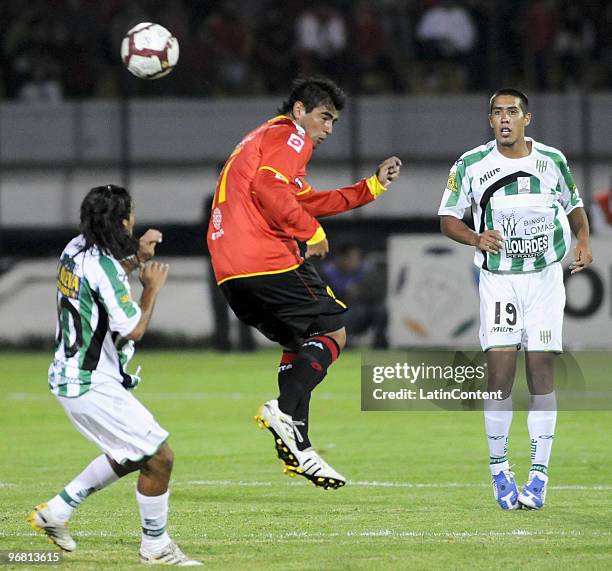 Deportivo Cuenca's Luis Miguel Escalada vies for the ball with Banfield's Walter Erviti during their match as part of 2010 Libertadores Cup at...