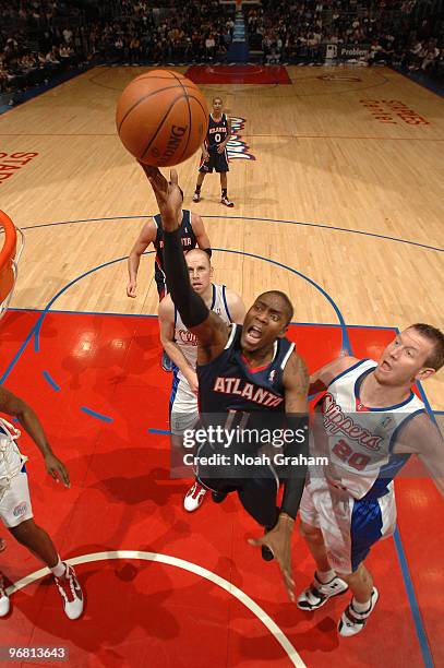Jamal Crawford of the Atlanta Hawks puts up a shot against Steve Novak of the Los Angeles Clippers at Staples Center on February 17, 2010 in Los...