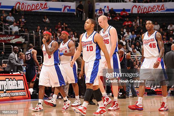 Bobby Brown, Craig Smith, Eric Gordon, Chris Kaman and Rasual Butler of the Los Angeles Clippers walk off the court during a break in their game...