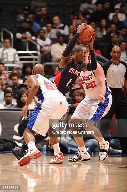 Jamal Crawford of the Atlanta Hawks drives to the basket against Steve Novak of the Los Angeles Clippers at Staples Center on February 17, 2010 in...