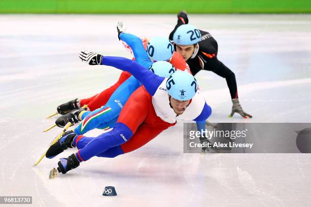 Thibaut Fauconnet of France leads Yuri Confortola of Italy, Semion Elistratov of Russia and Assen Pandov of Bulgaria in the Short Track Speed Skating...