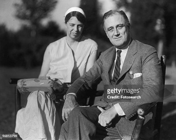 Portrait of President Franklin D. Roosevelt and wife Eleanor Roosevelt seated in garden, circa 1930s. .