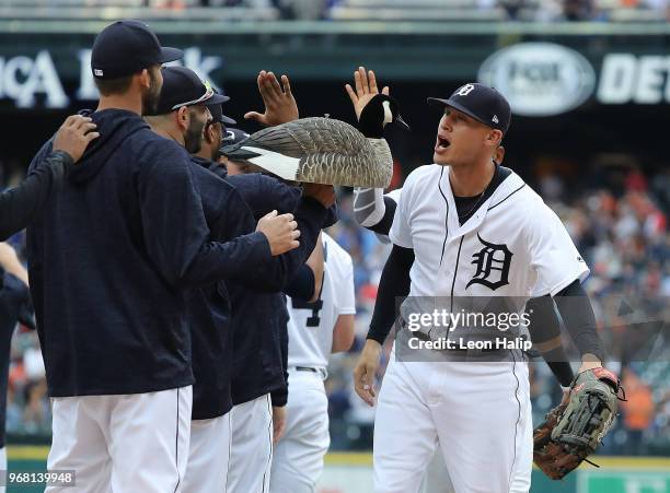 Mike Fiers of the Detroit Tigers carries the Rally Goose as JaCoby Jones celebrates a win over the Toronto Blue Jays at Comerica Park on June 2, 2018...